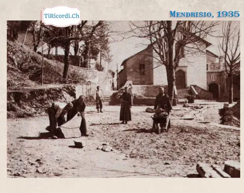 Mendrisio 1935: uomini al lavoro con teli, gerle e carriola sul piazzale sterrato davanti alla chiesa